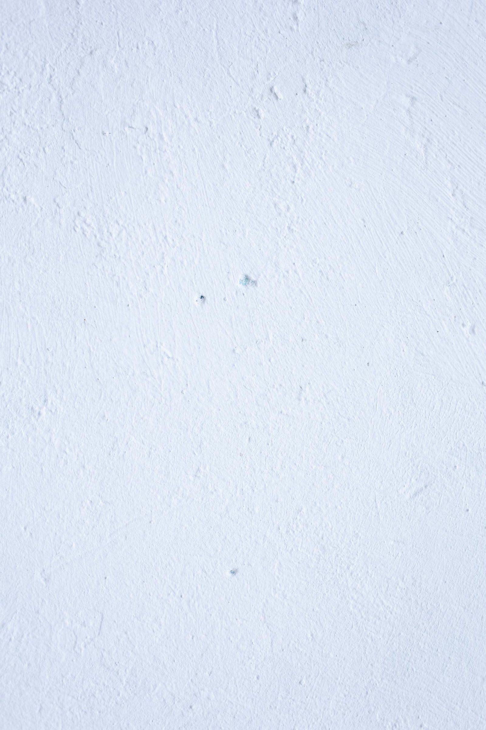 Background of light blue plaster wall